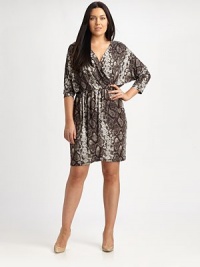 A sexy python print meets a flattering v-neckline giving this faux-wrap dress an exceptional look that you will love to wear.V-neckThree-quarter sleevesFaux wrap frontLeather waist detailAllover printAbout 23 from natural waist94% polyester/6% spandexMachine washImported