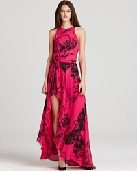 With an abstract print, potent hue and thigh-high slit, this Halston Heritage gown is the definition of hyper-modern glamour. With an abstract print, potent hue and thigh-high slit, this Halston Heritage gown is the definition of hyper-modern glamour.