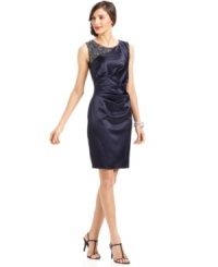 A sheer inset at the shoulder features an intricate beaded design--just one spectacular touch on this satin sheath from Eliza J. A sheer inset at the shoulder features an intricate beaded design--just one spectacular touch on this satin sheath from Eliza J.