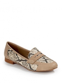 THE LOOKOval toeEmbossed snakeskin leather panelsPenny loafer detailSlip-on designStacked heelPadded insoleTHE MATERIALLeather upperLeather lining and soleORIGINImported THE LOOKOval toeEmbossed snakeskin leather panelsPenny loafer detailSlip-on designStacked heelPadded insoleTHE MATERIALLeather upperLeather lining and soleORIGINImported