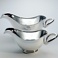 Vertigo table accessories are modern pieces for your table designed with a combination of silver holloware and crystal bases. Vertigo table accessories are a perfect compliment to other Vertigo pieces including: coffee service; barware; trays; open vegetable dish; and 3-part hors d'oeuvre server. Shown here is the Vertigo butter dish. Also available is a gravy boat; 4 part condiment set with tray; set of 4 knife rests ; salt & pepper; and jam jar. Vertigo table accessories are modern pieces for your table designed with a combination of silver holloware and crystal bases. Vertigo table accessories are a perfect compliment to other Vertigo pieces including: coffee service; barware; trays; open vegetable dish; and 3-part hors d'oeuvre server. Shown here is the Vertigo butter dish. Also available is a gravy boat; 4 part condiment set with tray; set of 4 knife rests ; salt & pepper; and jam jar.