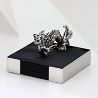 The grand form of a mythical dragon was the muse behind this sculptural, hand-cast napkin holder from Natori. The grand form of a mythical dragon was the muse behind this sculptural, hand-cast napkin holder from Natori.