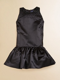 Glimmering tonal beads adorn the top of the classic satin party dress, giving a hint of sparkle to a stylish sleeveless silhouette.Round necklineSleevelessBack single-button closureHidden side zipperDrop-waistRuffled hemFull petticoatSilkDry cleanImportedSocks shown not sold Glimmering tonal beads adorn the top of the classic satin party dress, giving a hint of sparkle to a stylish sleeveless silhouette.Round necklineSleevelessBack single-button closureHidden side zipperDrop-waistRuffled hemFull petticoatSilkDry cleanImportedSocks shown not sold