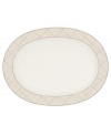 Dressed in a fine diamond grid of bronze and warm taupe, this oval platter is tailored for formal dining and everyday elegance in Noritake bone china. A handsome host for holiday meals or anytime feasts. From Noritake's collection of serveware and serving dishes.