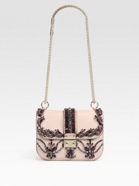 Sparkling crystals in crimson hues adorn this flap-top shape of rich leather, topped off with a versatile chain shoulder strap. Adjustable chain shoulder strap, 12¾-22¾ dropFlap-lock closureOne inside zip pocketOne inside open pocketCotton lining8W X 5½H X 2¼DMade in Italy Sparkling crystals in crimson hues adorn this flap-top shape of rich leather, topped off with a versatile chain shoulder strap. Adjustable chain shoulder strap, 12¾-22¾ dropFlap-lock closureOne inside zip pocketOne inside open pocketCotton lining8W X 5½H X 2¼DMade in Italy