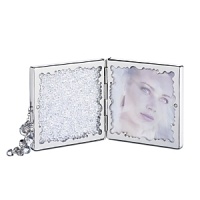 Take two photos of your loved-ones wherever you go. The hinged picture frame for two 2 3/4 x 2 7/8 photos and a mirror is small enough to go along with you. The clear crystal chatons and tassel accent of clear crystal beads add to the joy of reliving a memory. Take two photos of your loved-ones wherever you go. The hinged picture frame for two 2 3/4 x 2 7/8 photos and a mirror is small enough to go along with you. The clear crystal chatons and tassel accent of clear crystal beads add to the joy of reliving a memory.