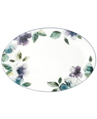 Watercolor florals adorn the canvas of white porcelain that is Mikasa's Paradise Bloom oval platter. A simple silhouette and band of blue complete this essential part of the everyday dinnerware collection. Watercolor florals adorn the canvas of white porcelain that is Mikasa's Paradise Bloom oval platter. A simple silhouette and band of blue complete this essential part of the everyday dinnerware collection.