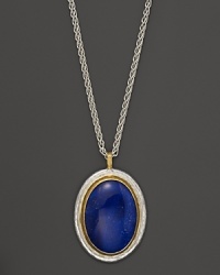 Framed in sterling silver and 24K gold, a lapis stone shines on Gurhan's Parliament necklace. Framed in sterling silver and 24K gold, a lapis stone shines on Gurhan's Parliament necklace.