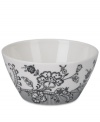 Oleg Cassini weaves a table of playful sophistication with the Ava fruit bowl, featuring lacy flowers and dots in timeless black and white.