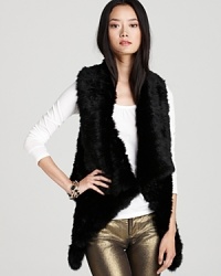 Layer up in the luxe fur of this Alice + Olivia vest. An open silhouette and cascading front adds instant glam. Layer up in the luxe fur of this Alice + Olivia vest. An open silhouette and cascading front adds instant glam.