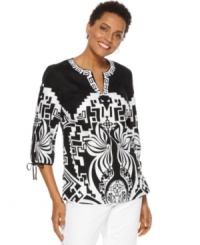 Make a statement in this printed tunic from JM Collection, featuring a bold graphic print and embroidery at the neckline. Make a statement in this printed tunic from JM Collection, featuring a bold graphic print and embroidery at the neckline.