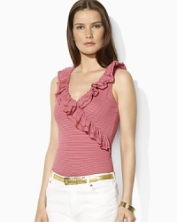 A flourish of ruffles along the neckline lends feminine appeal to a faux-wrap sleeveless top in soft cotton jersey. A flourish of ruffles along the neckline lends feminine appeal to a faux-wrap sleeveless top in soft cotton jersey.