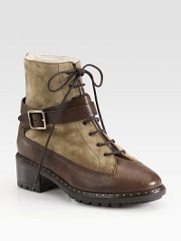 Military-inspired suede and leather design with a lace-up front and adjustable, wrap-around buckle. Stacked heel, 2 (50mm)Covered platform, ½ (15mm)Compares to a 1½ heel (40mm)Leather and suede upperGenuine dyed lamb fur liningRubber and leather solePadded insoleMade in ItalyOUR FIT MODEL RECOMMENDS ordering one half size up as this style runs small. Military-inspired suede and leather design with a lace-up front and adjustable, wrap-around buckle. Stacked heel, 2 (50mm)Covered platform, ½ (15mm)Compares to a 1½ heel (40mm)Leather and suede upperGenuine dyed lamb fur liningRubber and leather solePadded insoleMade in ItalyOUR FIT MODEL RECOMMENDS ordering one half size up as this style runs small.
