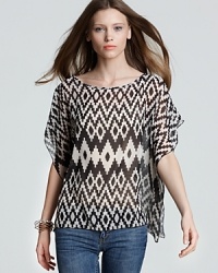 From the runway to your wardrobe, this Sweet Pea tribal-print top is the eclectic piece your wardrobe warrants. The streets are your catwalk when you choose this trend-forward style that elevates your days--and nights. From the runway to your wardrobe, this Sweet Pea tribal-print top is the eclectic piece your wardrobe warrants. The streets are your catwalk when you choose this trend-forward style that elevates your days--and nights.