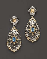 Blue topaz in intricately engraved sterling silver and 18K yellow gold from Konstantino. Blue topaz in intricately engraved sterling silver and 18K yellow gold from Konstantino.
