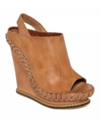 Free-spirited fashion. The Georgetta mules by Boutique 9 feature a retro silhouette with rugged leather braiding trimming the high wedge heel. Free-spirited fashion. The Georgetta mules by Boutique 9 feature a retro silhouette with rugged leather braiding trimming the high wedge heel.