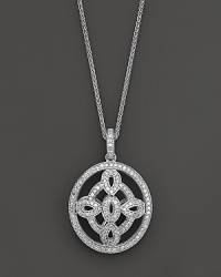 A dramatic oval medallion pendant crafted from white gold and diamonds, dangling from a 16 wheat chain. Domed to offer dimension.