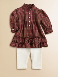 An adorable cotton plaid top adorned with ruffle trim is paired with essential leggings for an unbeatable match. Tunic Ruffled stand collarLong sleeves with ruffle-trimmed barrel cuffsButton-frontRuffled hemLeggings Elastic waistbandScalloped hemCottonMachine washImported Please note: Number of buttons may vary depending on size ordered. 