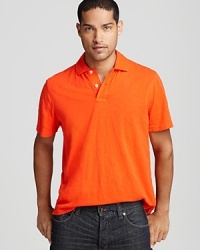 Enzyme-washed for super-rich color and rendered in slubby cotton for a textured feel, this casual cool solid polo looks and feels great everywhere you wear it.