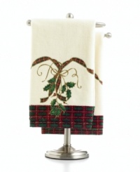 Delight and dazzle this season with these Lenox fingertip towels, featuring a traditional holiday plaid and holly embellished with glittery gold accents. This two-piece set makes the perfect gift in its attractive Lenox holiday box. Delight and dazzle this season with these Lenox fingertip towels, featuring a traditional holiday plaid and holly embellished with glittery gold accents. This two-piece set makes the perfect gift in its attractive Lenox holiday box.