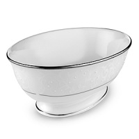 With enameled pearl-like dots, an opalescent background, and the innocence of bone china, Opal Innocence is a romantic pattern of understated elegance. Two bands of platinum a slightly wider one on the rim, kissing a thin fluted design, and a narrower one inside the border adorn each plate. The cup bears additional platinum on its graceful handle and another band at midpoint. Each piece is decorated with a flowing, white-on-white vine design peppered with enamel dots. This service creates a splendid formal table setting and, because of its neutral coloring, works well with any table décor. With enameled pearl-like dots, an opalescent background, and the innocence of bone china, Opal Innocence is a romantic pattern of understated elegance. Two bands of platinum a slightly wider one on the rim, kissing a thin fluted design, and a narrower one inside the border adorn each plate. The cup bears additional platinum on its graceful handle and another band at midpoint. Each piece is decorated with a flowing, white-on-white vine design peppered with enamel dots. This service creates a splendid formal table setting and, because of its neutral coloring, works well with any table décor.