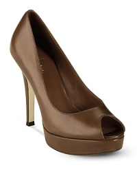 Peeptoe leather platform pumps in a fabulous design that flatters your feet with exaggerated scale, finessed with simple lines. Peeptoe leather platform pumps in a fabulous design that flatters your feet with exaggerated scale, finessed with simple lines.