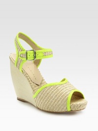 Textured raffia wedge design with an adjustable ankle strap and smooth, contrasting leather trim. Covered wedge, 4 (100mm)Self-covered platform, 1 (25mm)Compares to a 3 heel (75mm)Raffia and leather upperLeather lining and solePadded insoleImportedOUR FIT MODEL RECOMMENDS ordering true size. Textured raffia wedge design with an adjustable ankle strap and smooth, contrasting leather trim. Covered wedge, 4 (100mm)Self-covered platform, 1 (25mm)Compares to a 3 heel (75mm)Raffia and leather upperLeather lining and solePadded insoleImportedOUR FIT MODEL RECOMMENDS ordering true size.