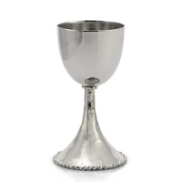 An elegant addition to holidays and Friday night dinners, this Kiddush cup possesses timeless beauty. In the designer's own words, the Molten collection is distinguished by streamlined, timeless shapes... objects which reverberate with the skill of their maker and yet do not fit into a traditional interpretation of craft. The pieces possess a soulfulness and organic energy only possible through the handmade process. An elegant addition to holidays and Friday night dinners, this Kiddush cup possesses timeless beauty. In the designer's own words, the Molten collection is distinguished by streamlined, timeless shapes... objects which reverberate with the skill of their maker and yet do not fit into a traditional interpretation of craft. The pieces possess a soulfulness and organic energy only possible through the handmade process.
