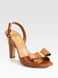 Goldtone hardware secures a simple bow on this leather silhouette with an adjustable slingback strap. Self-covered heel, 4 (100mm)Leather upperAdjustable slingback strapLeather lining and solePadded insoleImportedOUR FIT MODEL RECOMMENDS ordering one half size up as this style runs small. Goldtone hardware secures a simple bow on this leather silhouette with an adjustable slingback strap. Self-covered heel, 4 (100mm)Leather upperAdjustable slingback strapLeather lining and solePadded insoleImportedOUR FIT MODEL RECOMMENDS ordering one half size up as this style runs small.