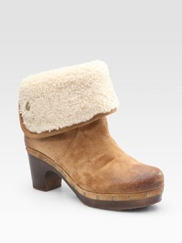 Soft slightly distressed suede clog updated by edgy studs and a plush shearling cuff. Wooden heel, 2½ (65mm) Covered platform, ¾ (20mm) Compares to a 1¾ heel (45mm) Suede upper Genuine shearling cuff Rubber sole Padded insole Imported Soft slightly distressed suede clog updated by edgy studs and a plush shearling cuff. Wooden heel, 2½ (65mm) Covered platform, ¾ (20mm) Compares to a 1¾ heel (45mm) Suede upper Genuine shearling cuff Rubber sole Padded insole Imported