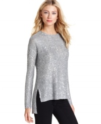 DKNYC's sequined sweater dazzles with a high-low hemline accentuated by side slits at the hips. DKNYC's sequined sweater dazzles with a high-low hemline accentuated by side slits at the hips.