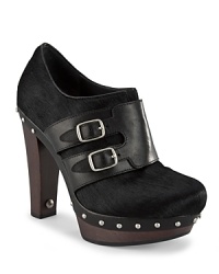 Boho meets rocker in these haute UGG® Australia Clog Booties, in mixed media punctuated by silver studs. Boho meets rocker in these haute UGG® Australia Clog Booties, in mixed media punctuated by silver studs.