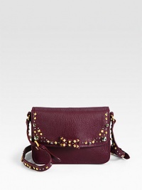 A supple leather design accented with studs, rhinestones and a sweet bow.Adjustable shoulder strap, 19½-20½ dropMagnetic snap flap closureThree inner compartmentsOne inside open pocketSatin lining7W X 5H X 2¾DMade in Italy A supple leather design accented with studs, rhinestones and a sweet bow.Adjustable shoulder strap, 19½-20½ dropMagnetic snap flap closureThree inner compartmentsOne inside open pocketSatin lining7W X 5H X 2¾DMade in Italy