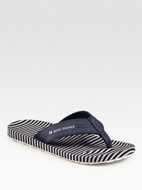 Leather thong sandal with logo detail and striped insole for a sporty feel.Leather upperPadded insoleRubber soleImported