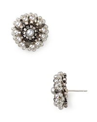 Geometric beading and natural shine illuminate these pretty studs from Miguel Ases, sure to add a simple shot of glamour to both silky dresses and crisp denim. Geometric beading and natural shine illuminate these pretty studs from Miguel Ases, sure to add a simple shot of glamour to both silky dresses and crisp denim.