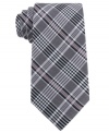 Start a crossover in your wardrobe. This tie from DKNY gives a punch of plaid to your nine-to-five.
