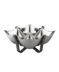 Set or simply decorate the table with the ultra-modern Anvil condiment bowl from Nambe's collection of serveware and serving dishes. A sculptural, iron-finished base cradles contoured silvertone alloy in this innovative Neil Cohen design. Set or simply decorate the table with the ultra-modern Anvil condiment bowl from Nambe's collection of serveware and serving dishes. A sculptural, iron-finished base cradles contoured silvertone alloy in this innovative Neil Cohen design.