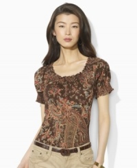 Imbued with breezy bohemian style, Lauren by Ralph Lauren's soft cotton jersey top gets a romantic update in a paisley print with a smocked neckline and cuffs.