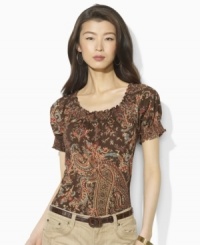 Imbued with breezy bohemian style, Lauren by Ralph Lauren's soft cotton jersey top gets a romantic update in a paisley print with a smocked neckline and cuffs. Imbued with breezy bohemian style, Lauren by Ralph Lauren's soft cotton jersey top gets a romantic update in a paisley print with a smocked neckline and cuffs.