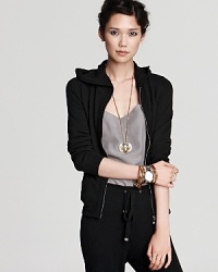A generous hoodie lends a sporty-chic finish to this cashmere Magaschoni top for a chic take on this season's athletic-inspired looks. A generous hoodie lends a sporty-chic finish to this cashmere Magaschoni top for a chic take on this season's athletic-inspired looks.