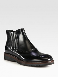 A traditional-inspired brogue style, is reinvented into a modern ankle boot set in polished leather with perforated detail and contrast detail at the sole.Leather upperLeather liningPadded insoleRubber sole Made in Italy A traditional-inspired brogue style, is reinvented into a modern ankle boot set in polished leather with perforated detail and contrast detail at the sole.Leather upperLeather liningPadded insoleRubber sole Made in Italy