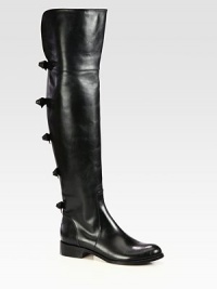Achieve the height of chic with this tall leather silhouette with bow adornments. Stacked heel, 1¼; (30mm)Shaft, 22¾Leg circumference, 15Leather upperLeather lining and solePadded insoleMade in ItalyOUR FIT MODEL RECOMMENDS ordering one half size up as this style runs small. Achieve the height of chic with this tall leather silhouette with bow adornments. Stacked heel, 1¼; (30mm)Shaft, 22¾Leg circumference, 15Leather upperLeather lining and solePadded insoleMade in ItalyOUR FIT MODEL RECOMMENDS ordering one half size up as this style runs small.