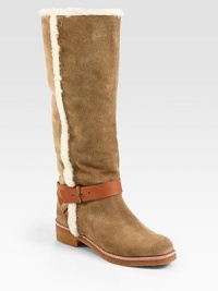 Shearling trim adds textural appeal to this suede design, finished with a wrap-around leather ankle strap. Rubber heel, 1¼ (30mm)Rubber platform, ½ (15mm)Compares to a ¾ heel (20mm)Shaft, 15Leg circumference, 16Suede upper with shearling trim and a leather adjustable tab ankle strapPull-on styleLeather liningRubber solePadded insoleImported Shearling trim adds textural appeal to this suede design, finished with a wrap-around leather ankle strap. Rubber heel, 1¼ (30mm)Rubber platform, ½ (15mm)Compares to a ¾ heel (20mm)Shaft, 15Leg circumference, 16Suede upper with shearling trim and a leather adjustable tab ankle strapPull-on styleLeather liningRubber solePadded insoleImported