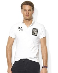 An essential short-sleeved polo in breathable cotton mesh is tailored for a trim, modern fit for a stylish yet athletic look. An essential short-sleeved polo in breathable cotton mesh is tailored for a trim, modern fit for a stylish yet athletic look.