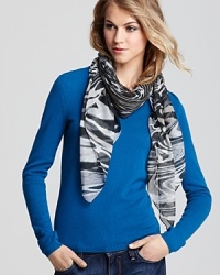 Click your heels three times for this eye-catching Aqua scarf, covered with tornado-like swirls of animal print. Click your heels three times for this eye-catching Aqua scarf, covered with tornado-like swirls of animal print.