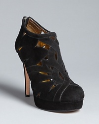 DKNY gives this season's must-buy booties added appeal with intricate cut outs. Wear bare, with black hose, or bright tights to show off the pattern. DKNY gives this season's must-buy booties added appeal with intricate cut outs. Wear bare, with black hose, or bright tights to show off the pattern.