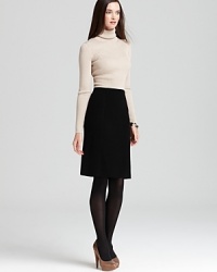 Effortlessly elegant, this Anne Klein sweater dress eases into the season with a sumptuous ribbed top and sleek contrast skirt. Effortlessly elegant, this Anne Klein sweater dress eases into the season with a sumptuous ribbed top and sleek contrast skirt.