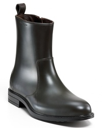 Boasting an of-the-moment abbreviated silhouette, these slick Salvatore Ferragamo boots prove rain can't stop sharp Italian style. Boasting an of-the-moment abbreviated silhouette, these slick Salvatore Ferragamo boots prove rain can't stop sharp Italian style.
