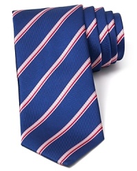 A perfect balance of classic and modern, with a handsome and traditional stripe pattern crafted with an on-trend skinny width, this tie transitions seamlessly from work to a downtown art opening or dinner with clients. A perfect balance of classic and modern, with a handsome and traditional stripe pattern crafted with an on-trend skinny width, this tie transitions seamlessly from work to a downtown art opening or dinner with clients.