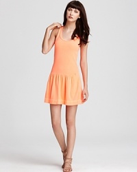 Sport this season's new athletic look in this Juicy Couture tank dress. A drop waist and ruffled skirt lend feminine appeal to the classic silhouette. Sport this season's new athletic look in this Juicy Couture tank dress. A drop waist and ruffled skirt lend feminine appeal to the classic silhouette.